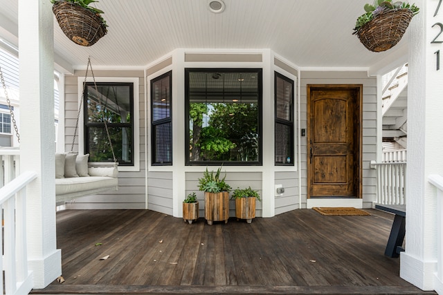 view of exterior entry with covered porch