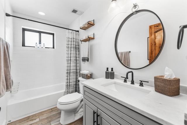 full bathroom with toilet, shower / bathtub combination with curtain, vanity, and wood-type flooring