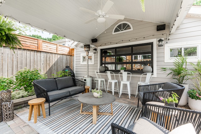 view of patio / terrace featuring ceiling fan and an outdoor living space