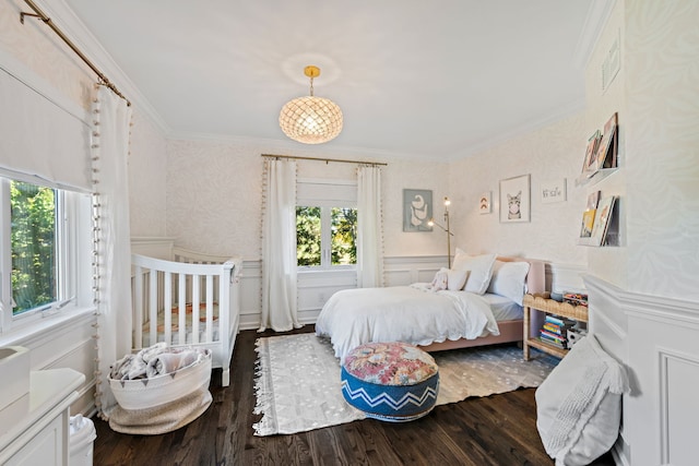 bedroom featuring crown molding and dark hardwood / wood-style flooring