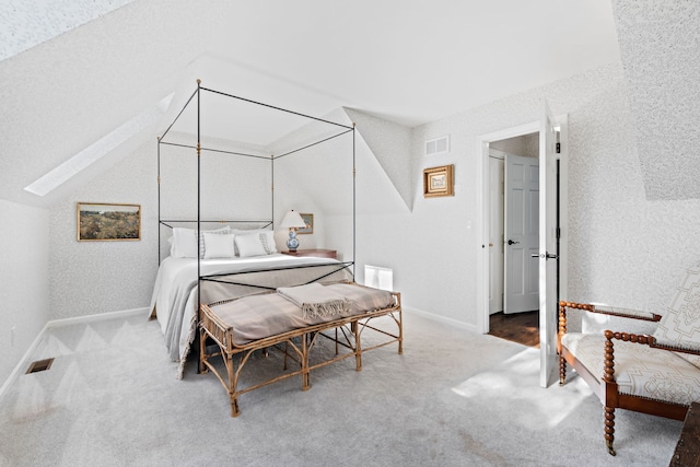 carpeted bedroom featuring vaulted ceiling