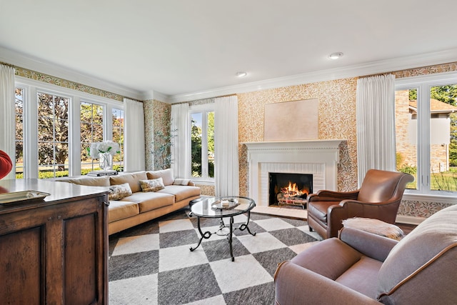 carpeted living room featuring a wealth of natural light, ornamental molding, and a brick fireplace