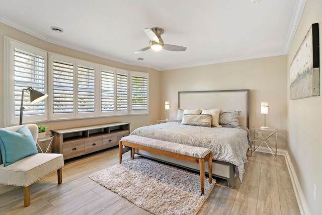 bedroom featuring ceiling fan, crown molding, and light hardwood / wood-style flooring