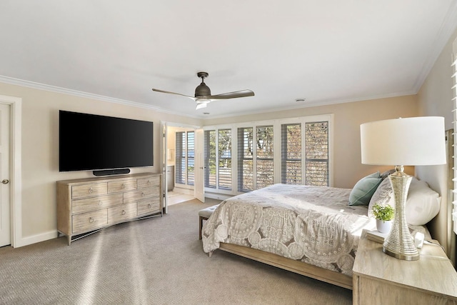 bedroom featuring crown molding, carpet floors, and ceiling fan