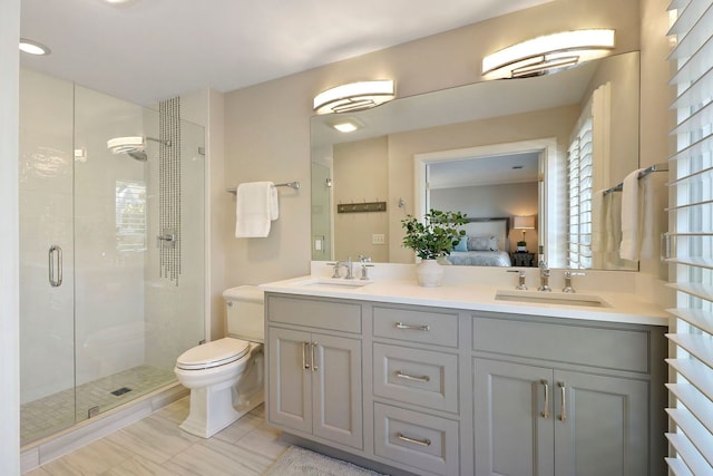 bathroom with vanity, toilet, tile patterned flooring, and an enclosed shower