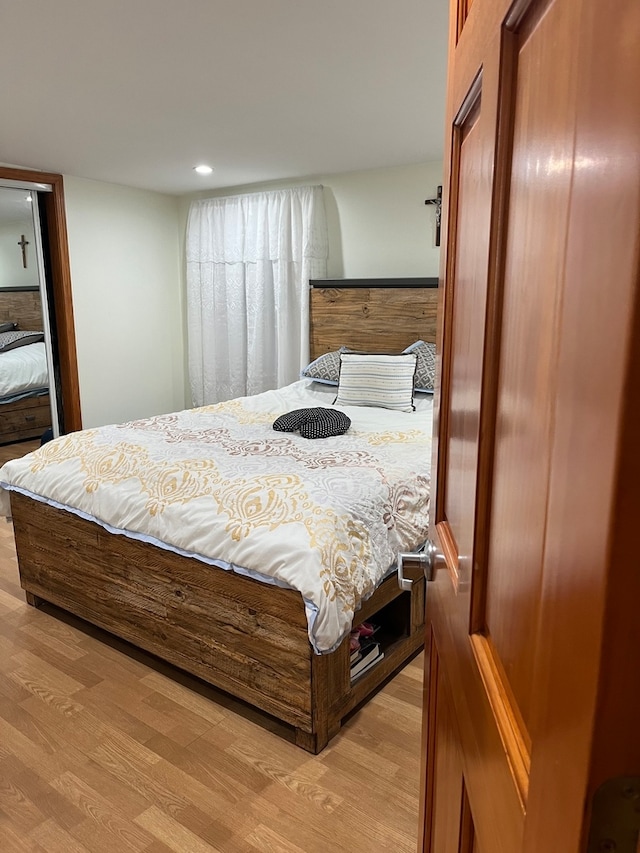 bedroom with light hardwood / wood-style floors