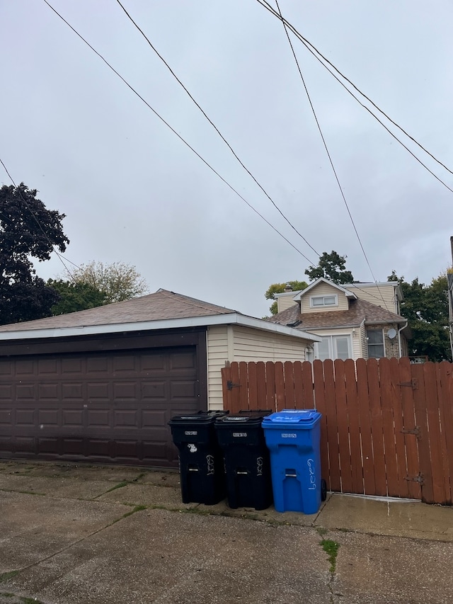 exterior space featuring an outbuilding and a garage