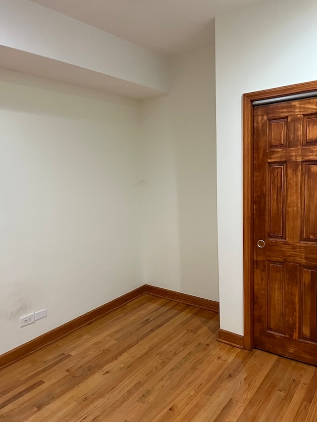 spare room featuring light wood-type flooring