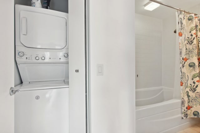 laundry room with stacked washer and dryer