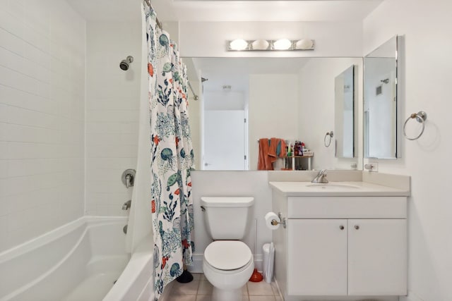 full bathroom featuring tile patterned flooring, vanity, shower / bath combo with shower curtain, and toilet