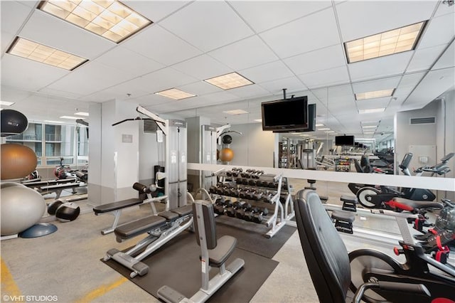 workout area featuring a drop ceiling