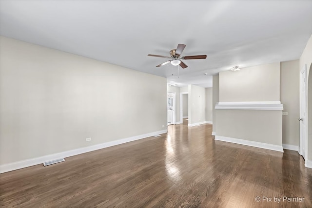 unfurnished room featuring ceiling fan and dark hardwood / wood-style flooring