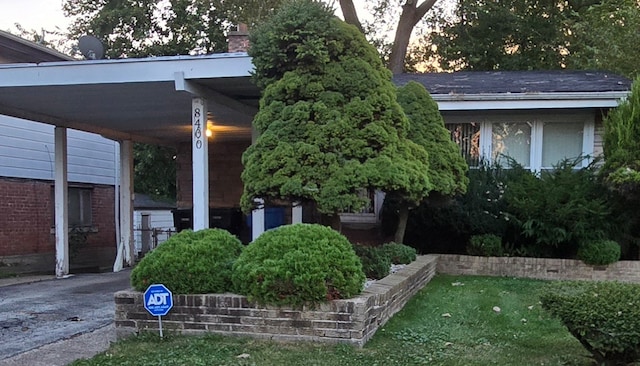 exterior space featuring a carport