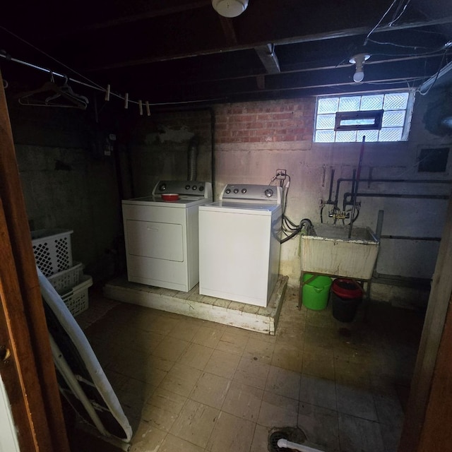 basement with washing machine and clothes dryer