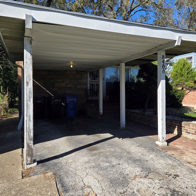 view of vehicle parking with a carport