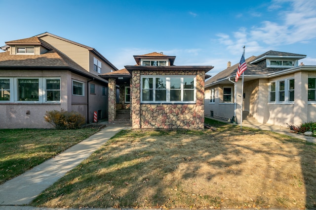 view of front of home with a front yard