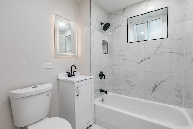 full bathroom with tiled shower / bath, vanity, and toilet