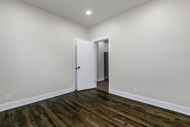 empty room featuring dark hardwood / wood-style floors