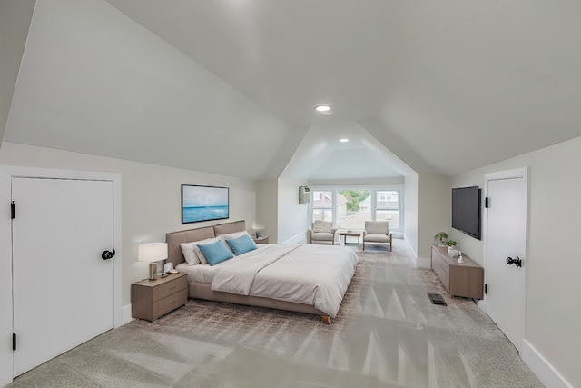 carpeted bedroom featuring lofted ceiling