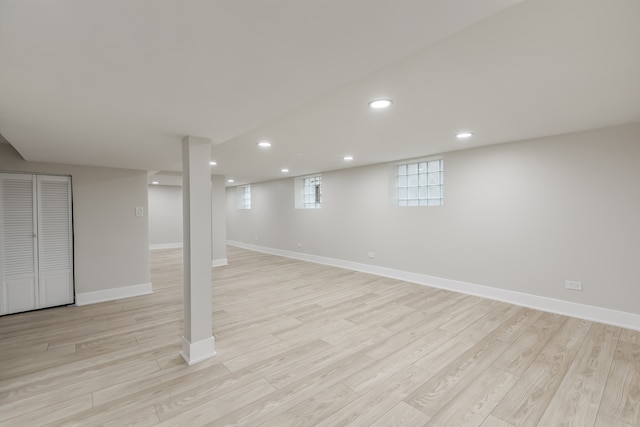 basement featuring light hardwood / wood-style flooring