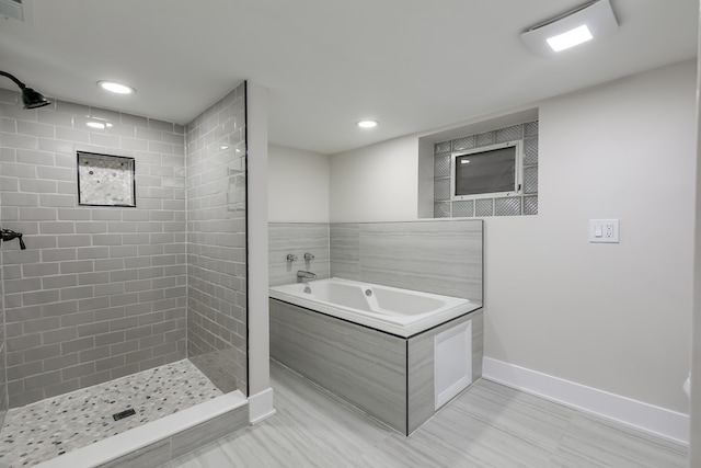 bathroom with shower with separate bathtub