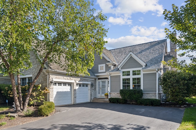 view of front of property with a garage