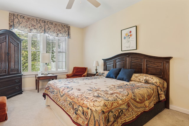 bedroom with light colored carpet and ceiling fan