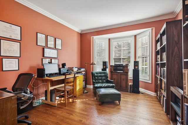 home office featuring crown molding and light hardwood / wood-style flooring