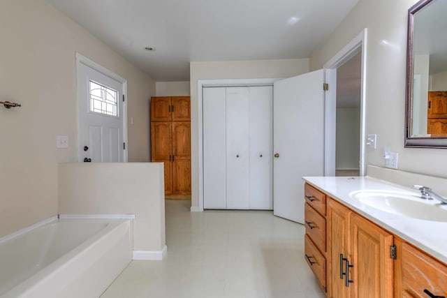 bathroom with vanity and a bathing tub