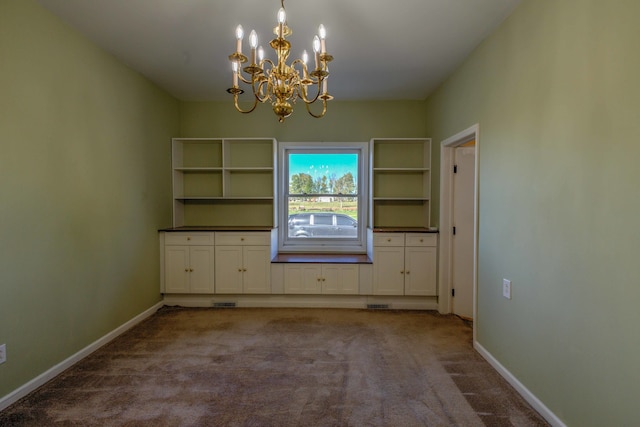 unfurnished dining area featuring carpet floors and a chandelier