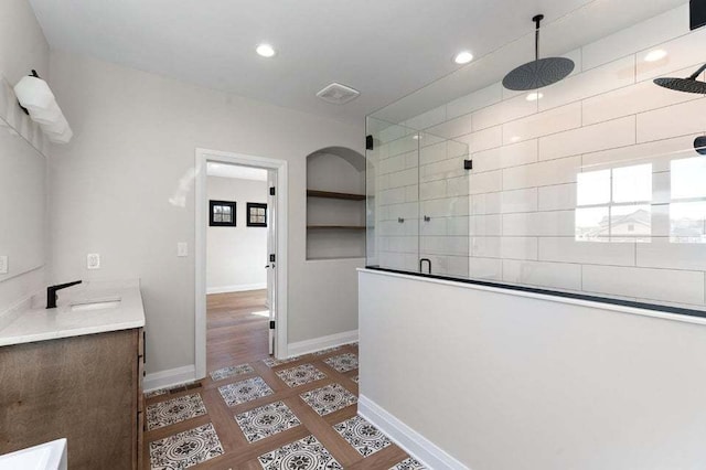 interior space featuring an enclosed shower, hardwood / wood-style floors, and vanity