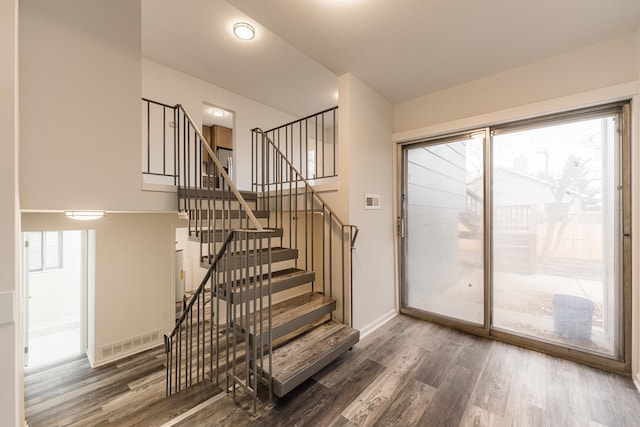 interior space featuring plenty of natural light and dark wood-type flooring