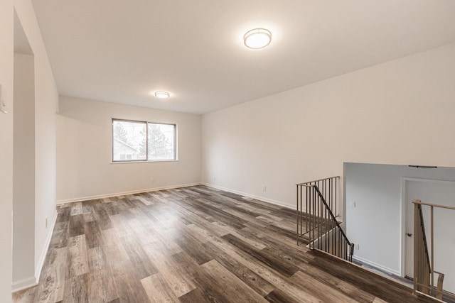 spare room featuring wood-type flooring