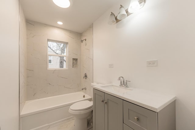 full bathroom with vanity, toilet, and tiled shower / bath