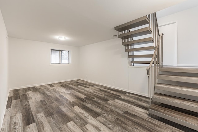 basement with dark wood-type flooring