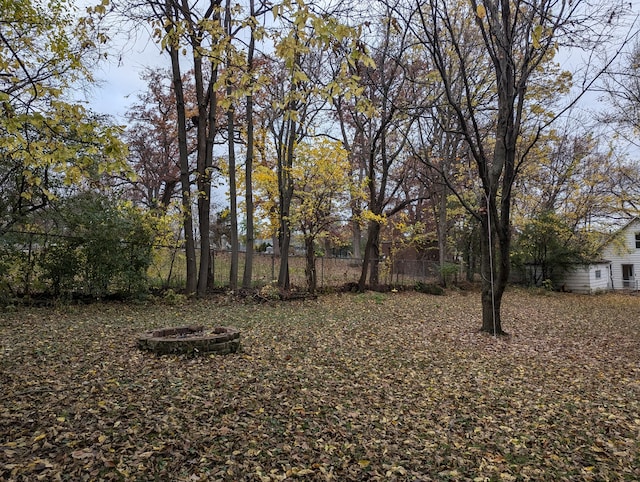 view of yard with a fire pit