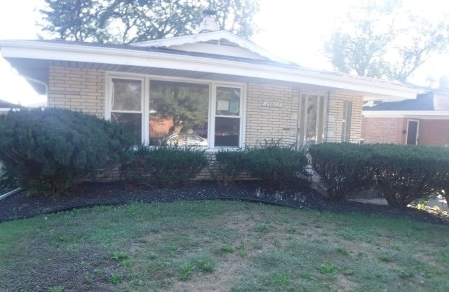 view of home's exterior featuring a lawn