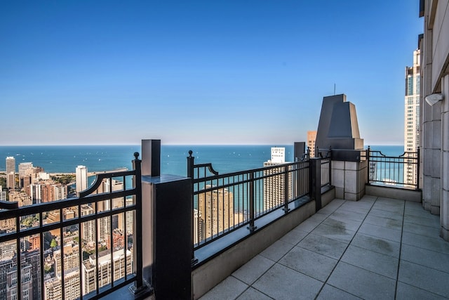 balcony featuring a water view