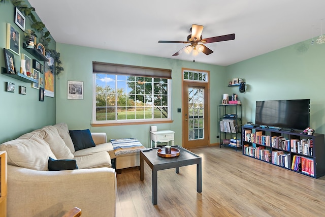 living room featuring light hardwood / wood-style flooring, plenty of natural light, and ceiling fan