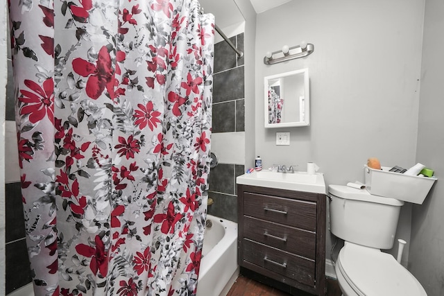 bathroom featuring vanity, wood-type flooring, and toilet