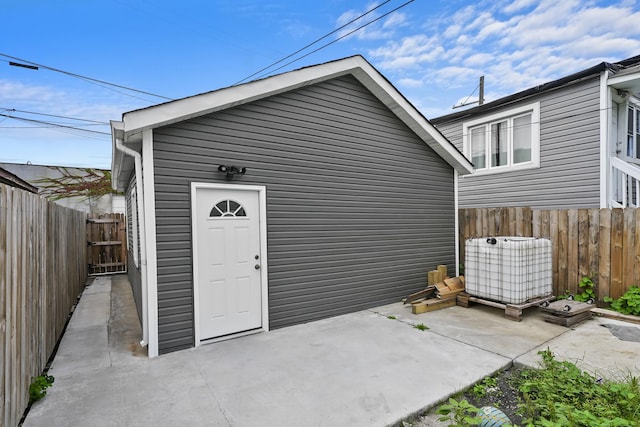 property entrance featuring a patio