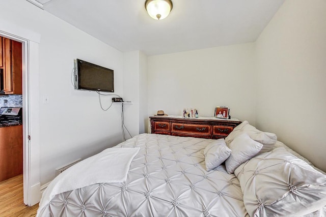 bedroom with light hardwood / wood-style flooring