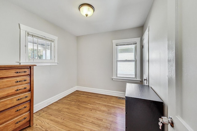 spare room featuring light hardwood / wood-style floors