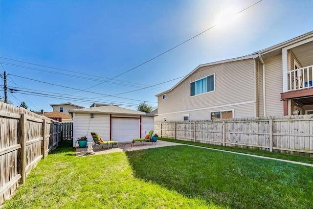 rear view of house with a lawn and a patio area