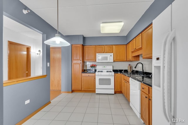 kitchen with white appliances, sink, light tile patterned floors, tasteful backsplash, and decorative light fixtures