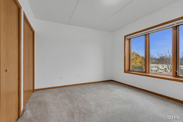 unfurnished bedroom featuring light colored carpet