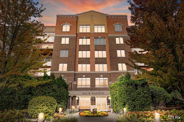 view of outdoor building at dusk