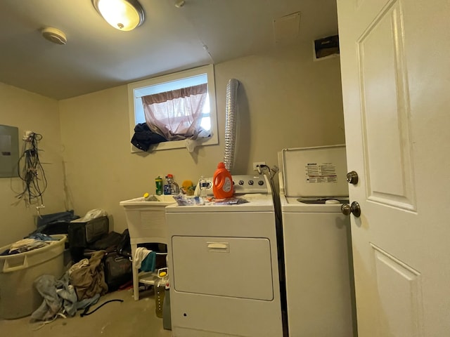 clothes washing area featuring independent washer and dryer