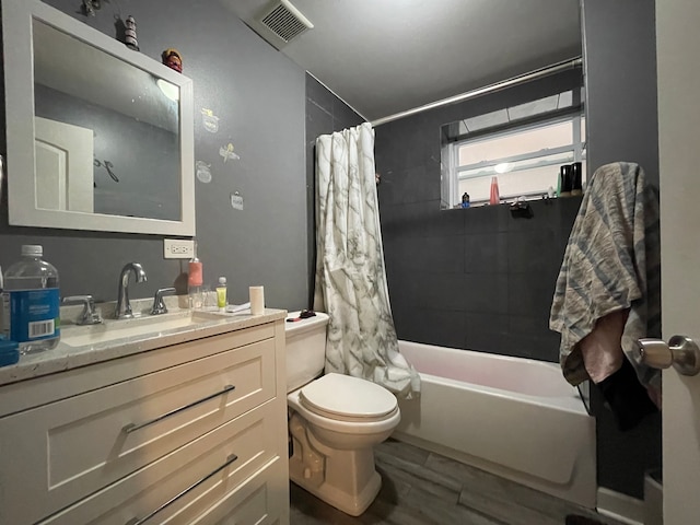 full bathroom with toilet, vanity, and shower / bathtub combination with curtain