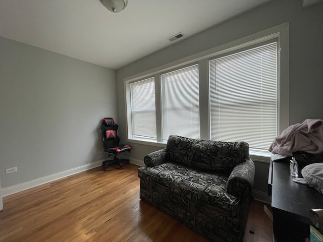 living area with hardwood / wood-style flooring